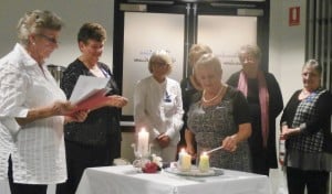 President Diane Parker lighting a candle of commitment.